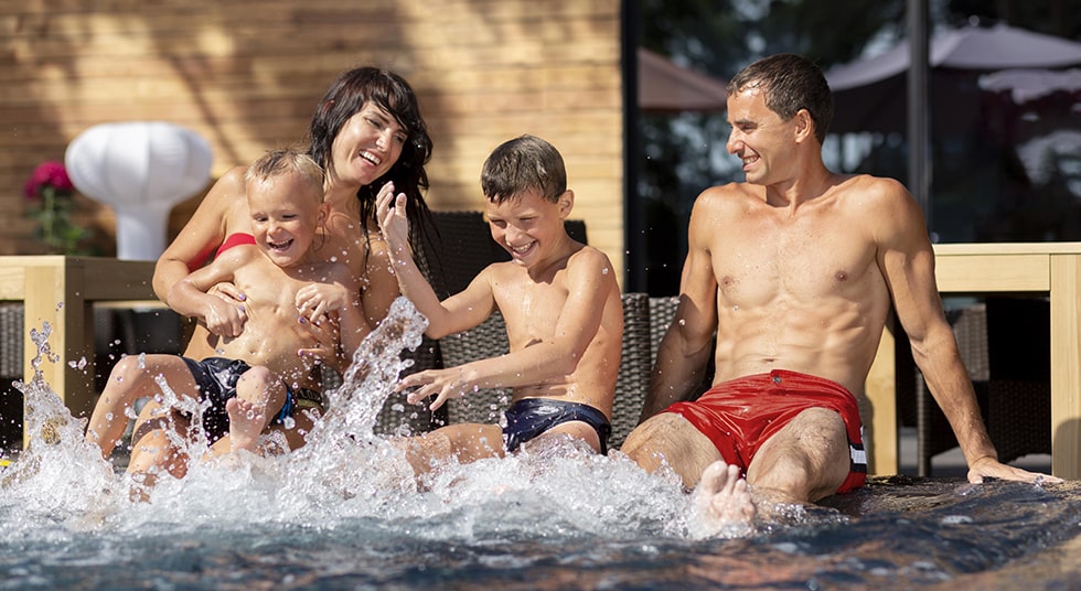 family having fun in pool area cancun