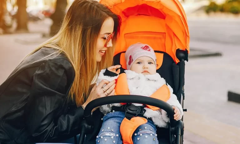 young mother with daughter in stroller