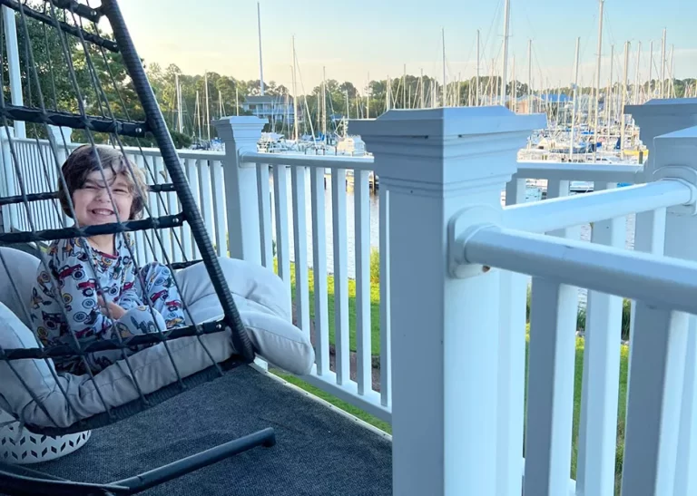 New Bern, NC boy sitting on deck