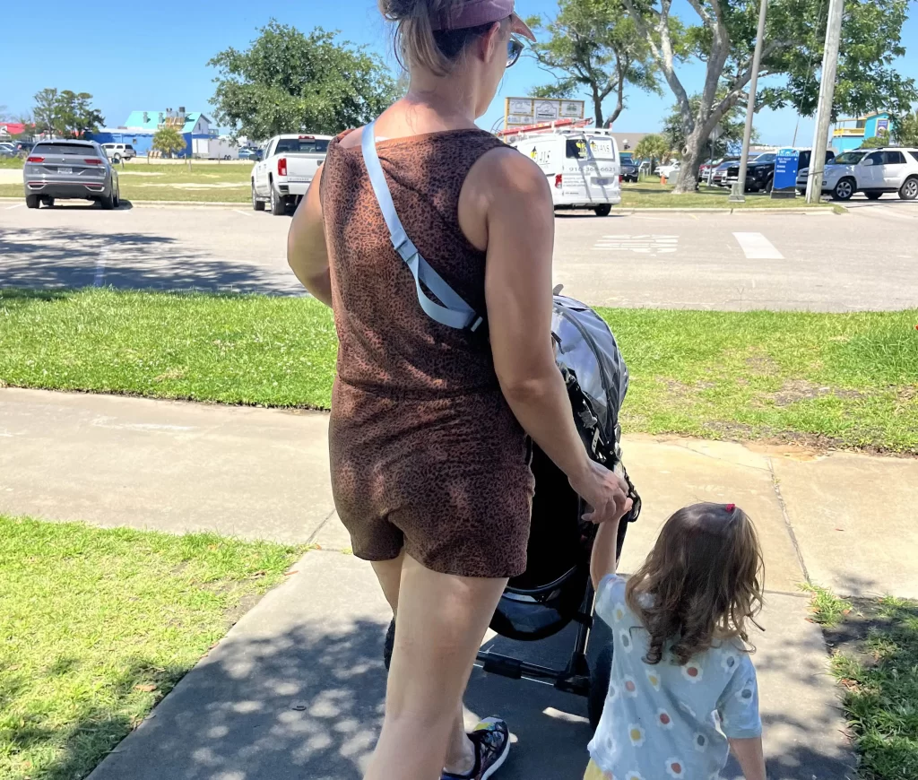 mom walking with kids on sidewalk