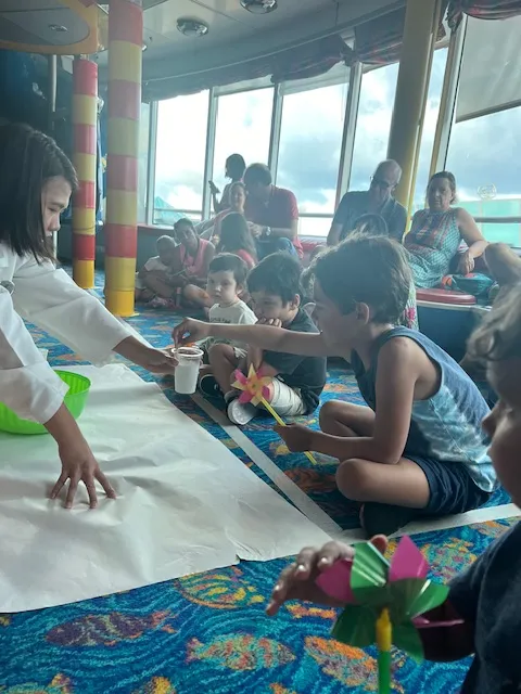 A boy at Kids Club interacting with instructor.