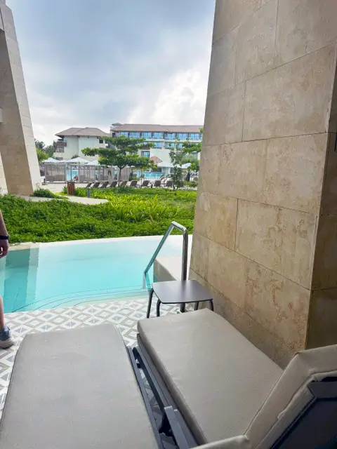 Private swim-up pool patio with lounge chairs at Secrets Playa Esmeralda resort in Miches.